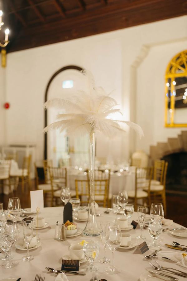 Romantic evening ambiance at a Boulevard Club wedding with soft uplighting and lush greenery